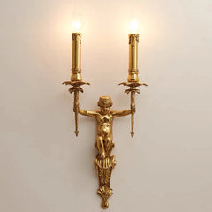 Gold wall sconce with classical design on a light background