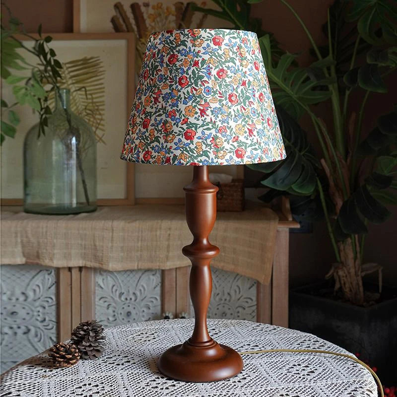 “Nordic floral bedside light on hand-turned wood base for cozy décor”