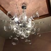 Chandelier with multiple glass bulbs on a ceiling