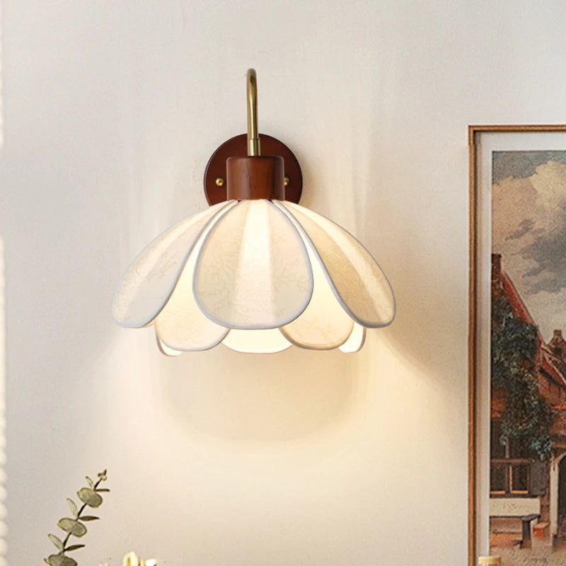 Wall-mounted lamp with a glass shade in a room setting