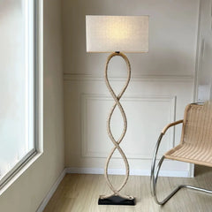 “Organic modern lamp with hand-knitted rope and soft fabric shade”
