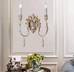 “Ornate double arm wall sconce for hallways and living rooms”