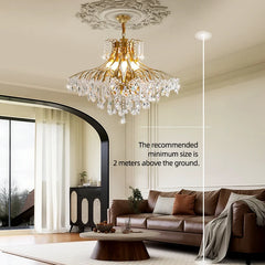 Plated metal crystal chandelier centered above a luxury living space