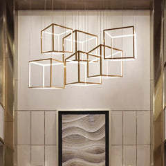 “Polished chrome geometric cube pendant for stylish interiors”