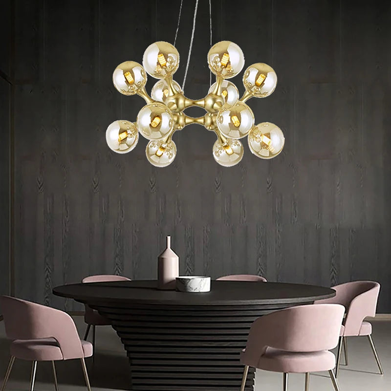 Polished steel chandelier with glass globes creating an artistic centrepiece in a stylish home