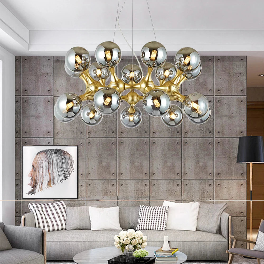 Sculptural glass ball chandelier with polished steel finish illuminating a modern living room
