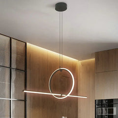 Modern pendant light fixture in a kitchen with wooden cabinets