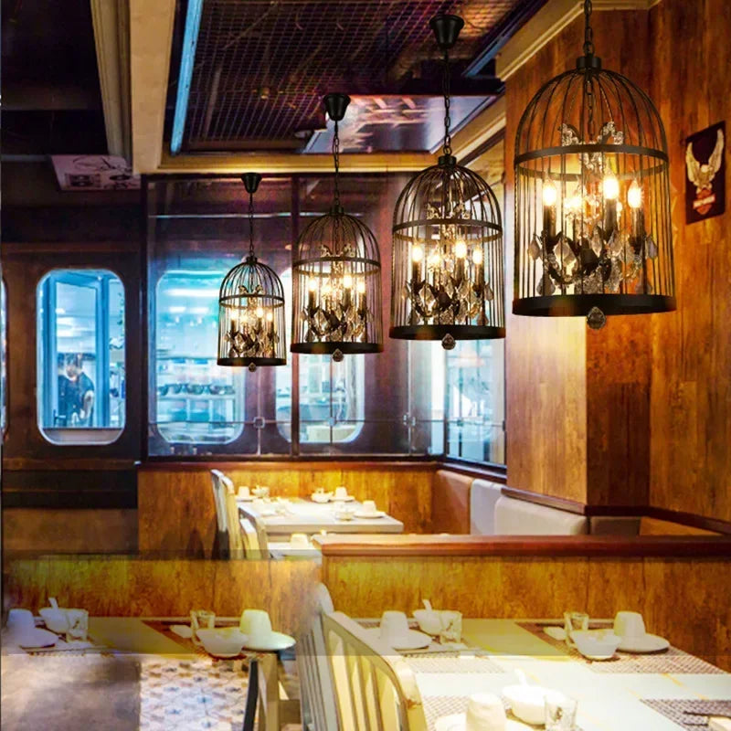 Dining area with wooden walls, hanging chandelier-style lights, and tables set for meals. Crystal pendant chandelier for coffee shop or dining space