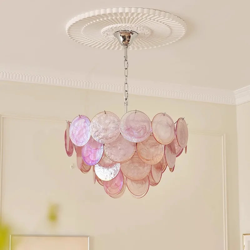 Pink and white chandelier hanging from the ceiling in a room with a lamp, Retro art dimmable ceiling light for living room decor and wall.