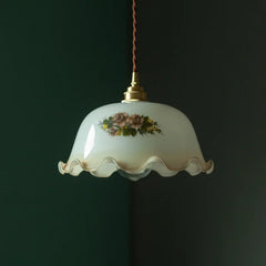 Decorative pendant light with floral design on a dark background. Retro floral hanging light for restaurants or bedrooms.