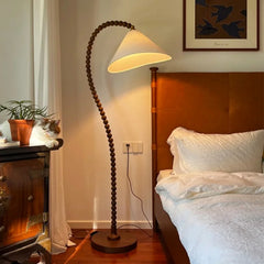 “Solid wood French retro floor lamp with arc fishing design”