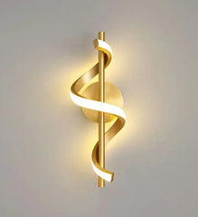 “Spiral LED wall lamp in black, gold, and white finish”