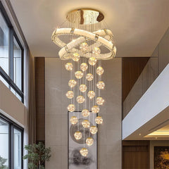 Dimmable crystal chandelier designed for a stairwell and entryway space