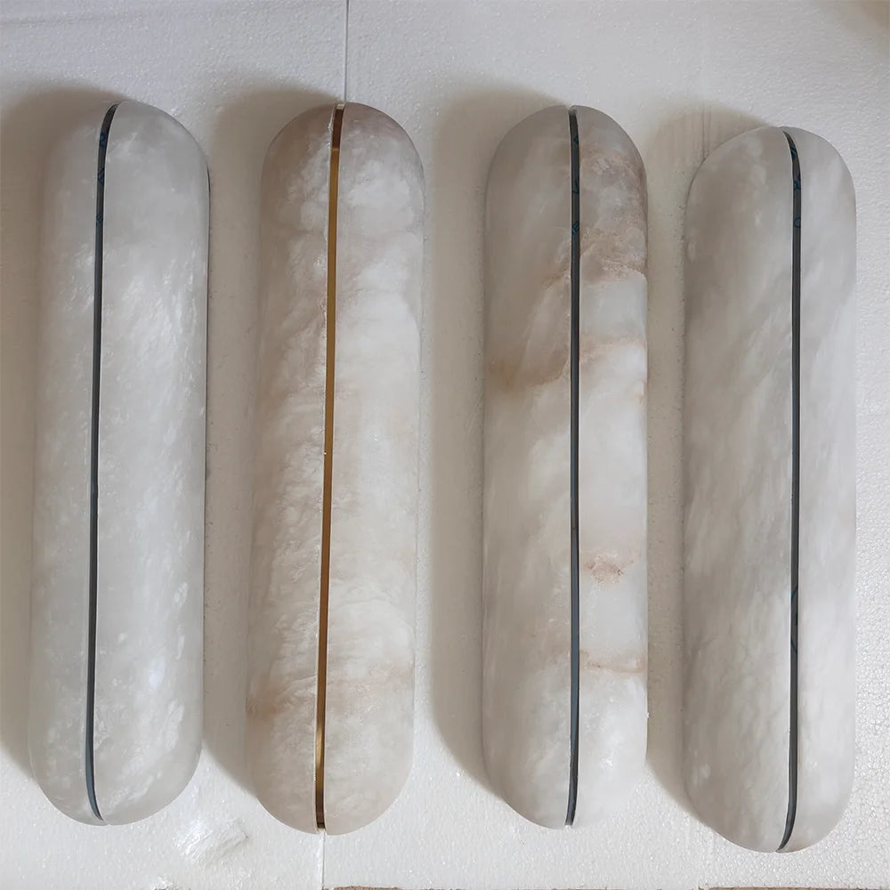 Alabaster marble wall light installed as staircase wall fixture with copper body