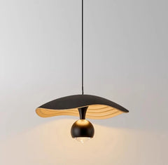 Sleek pendant chandelier lighting up a cozy study or home bar