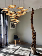 Textured metal chandelier with layered modern ceiling design