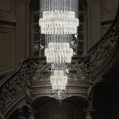 Statement chandelier with brushed stainless finish for villa lobby interiors