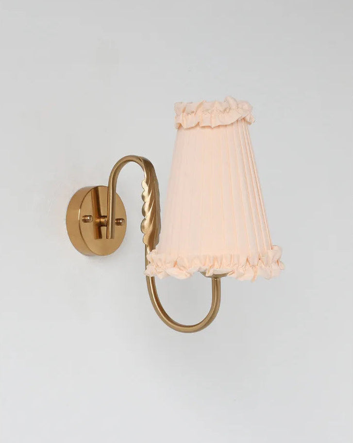 Vintage brass wall light with soft-glow pleated lampshade for elegant interiors