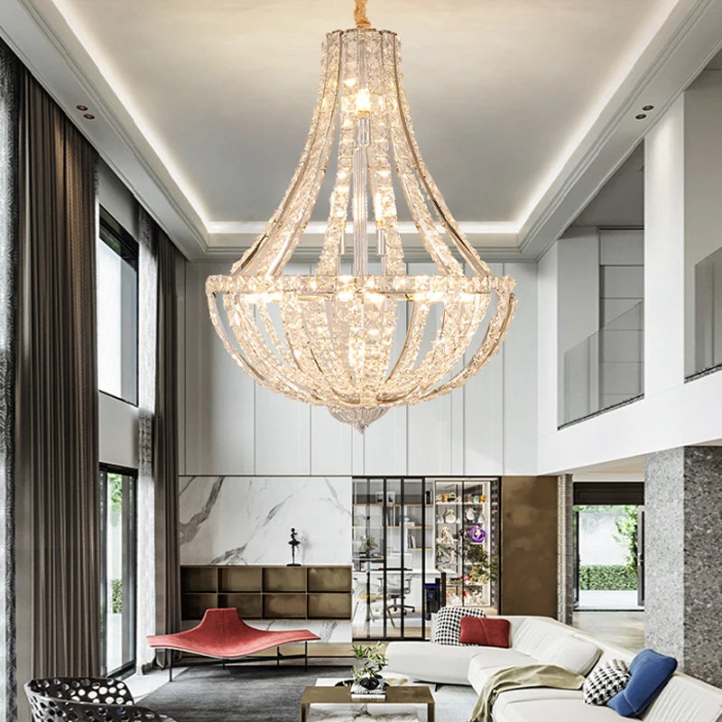 Grand crystal chandelier illuminating a luxury living room staircase
