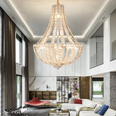 Grand crystal chandelier illuminating a luxury living room staircase