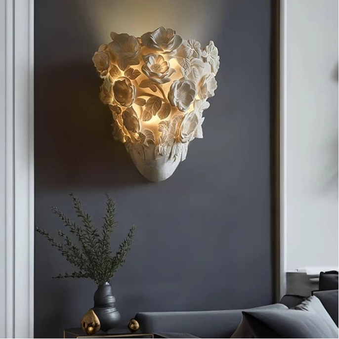 Decorative wall light fixture on a wall with a plant and sofa in the background, featuring No.7 Lighting logo.