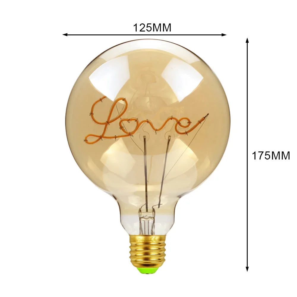 Decorative light bulb with 'Love' inscription and dimensions on a white background