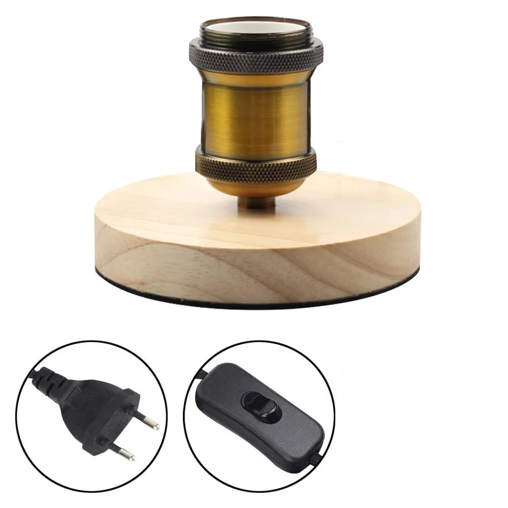 Wooden lamp base with brass fitting and electrical components on a white background