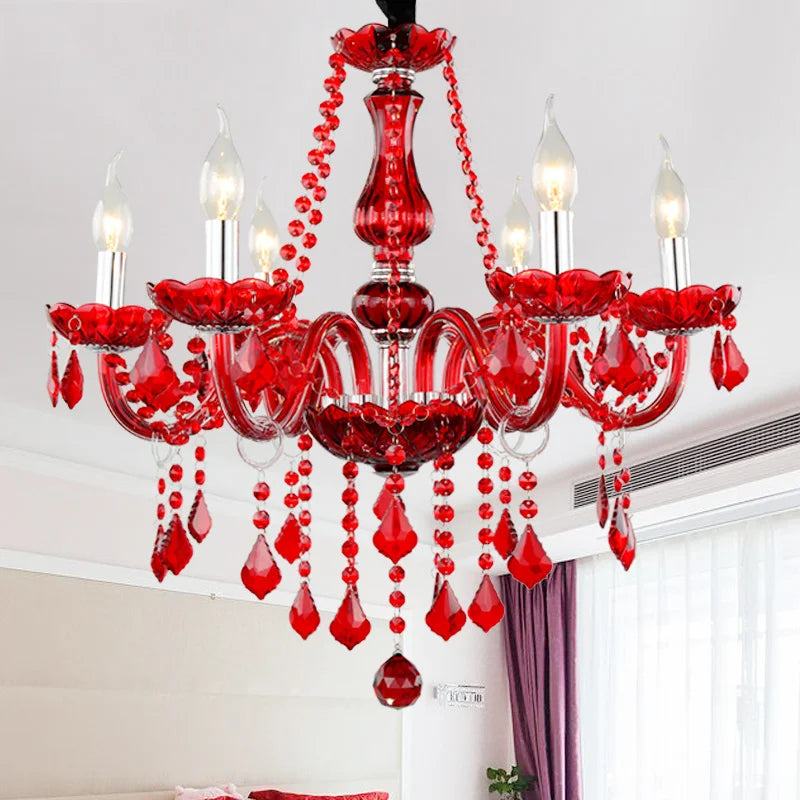 Red crystal chandelier with six exposed bulbs and cascading crystal droplets, mounted on a white ceiling.