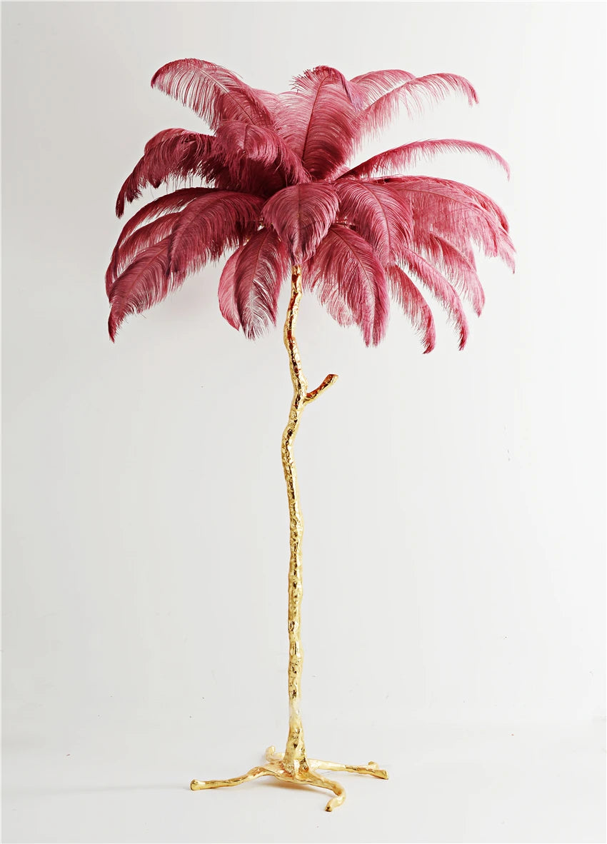Decorative palm tree with pink feathers on a white background