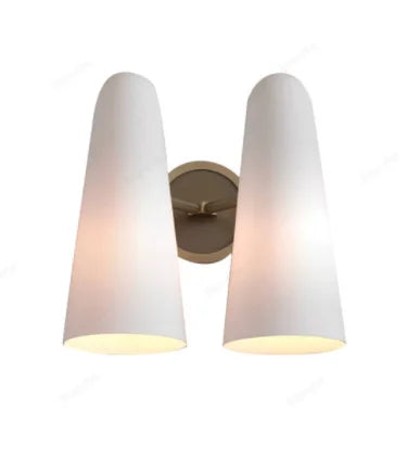 Wall-mounted light fixture with two white conical lampshades on a white background