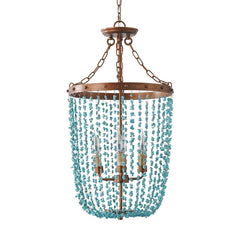 Turquoise stone bead chandelier with a distressed gold frame and three visible bulbs, isolated on a white background.