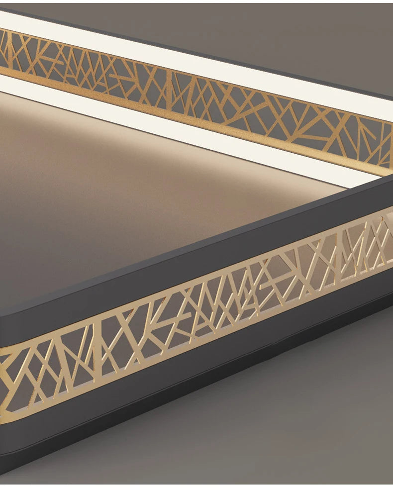 Decorative metal frame with geometric patterns on a gray background