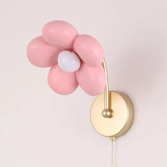 Wall lamp with pink flower-shaped lights and gold base on a light gray background