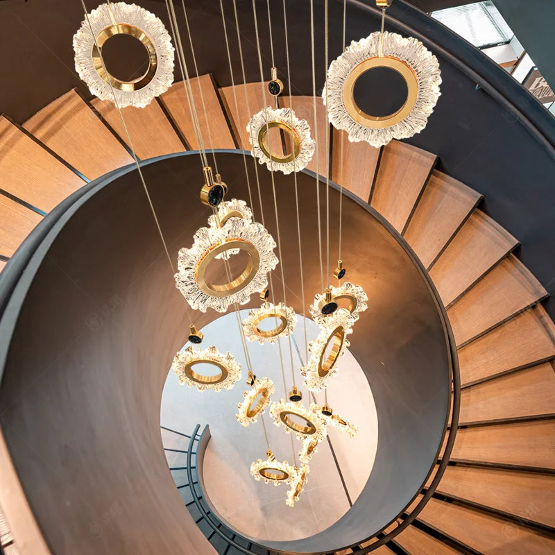 Decorative chandelier hanging above a spiral staircase