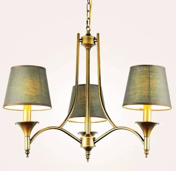 Chandelier with three lampshades on a light pink background