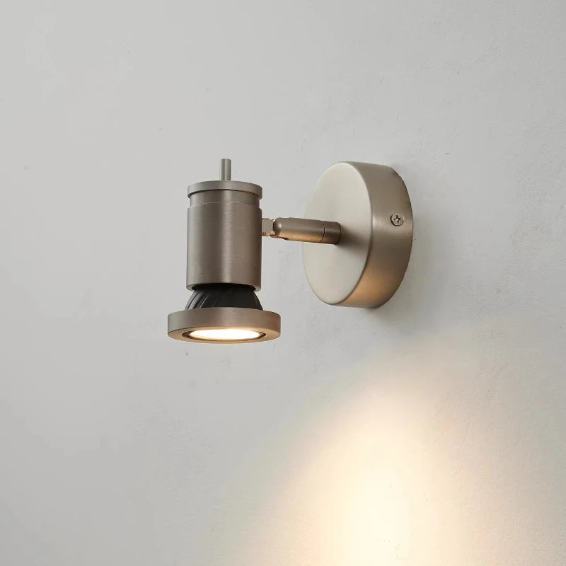 Side view of a single adjustable LED wall sconce with a silver finish, showing the articulated arm and light head.