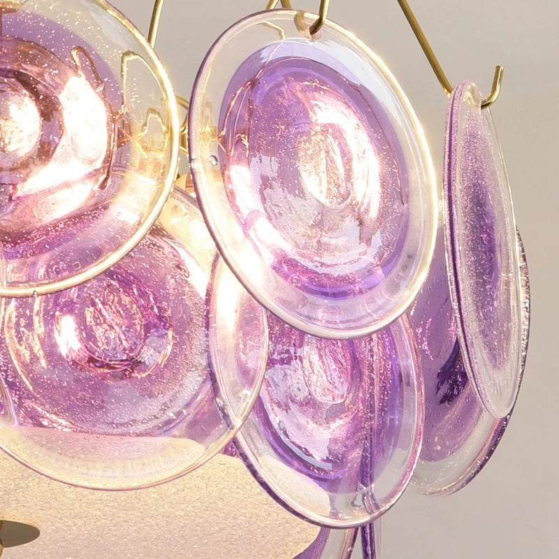View of the chandelier's structure showing the gold finish and the arrangement of glass discs
