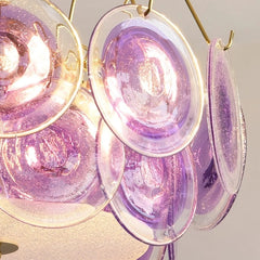 View of the chandelier's structure showing the gold finish and the arrangement of glass discs