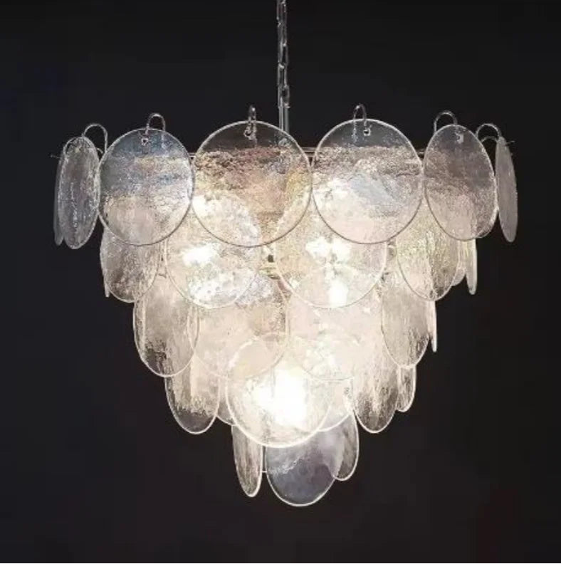 Chandelier with circular glass panels on a black background