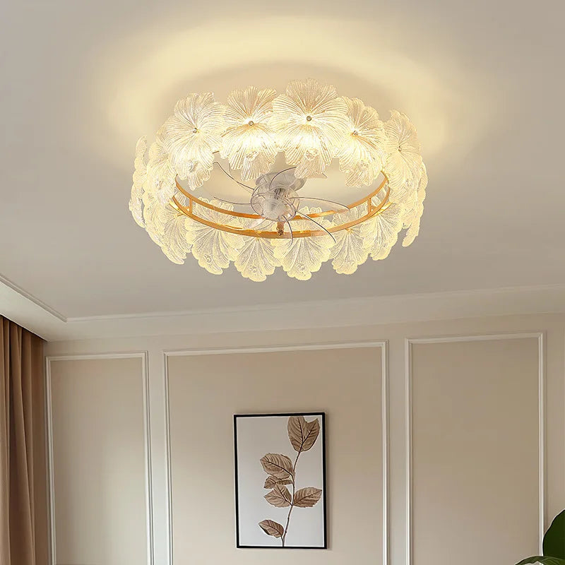 View of the gold floral glass semi-flush mount ceiling light installed on a white ceiling in a well-lit room with curtains and artwork visible.