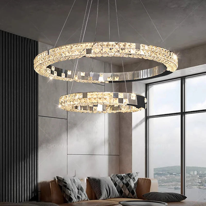 Modern chandelier with two circular rings in a living room setting.