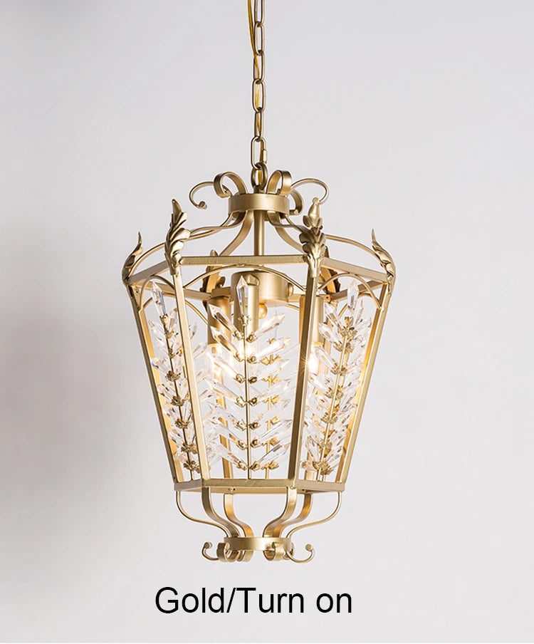 Gold pendant light fixture on a gray background