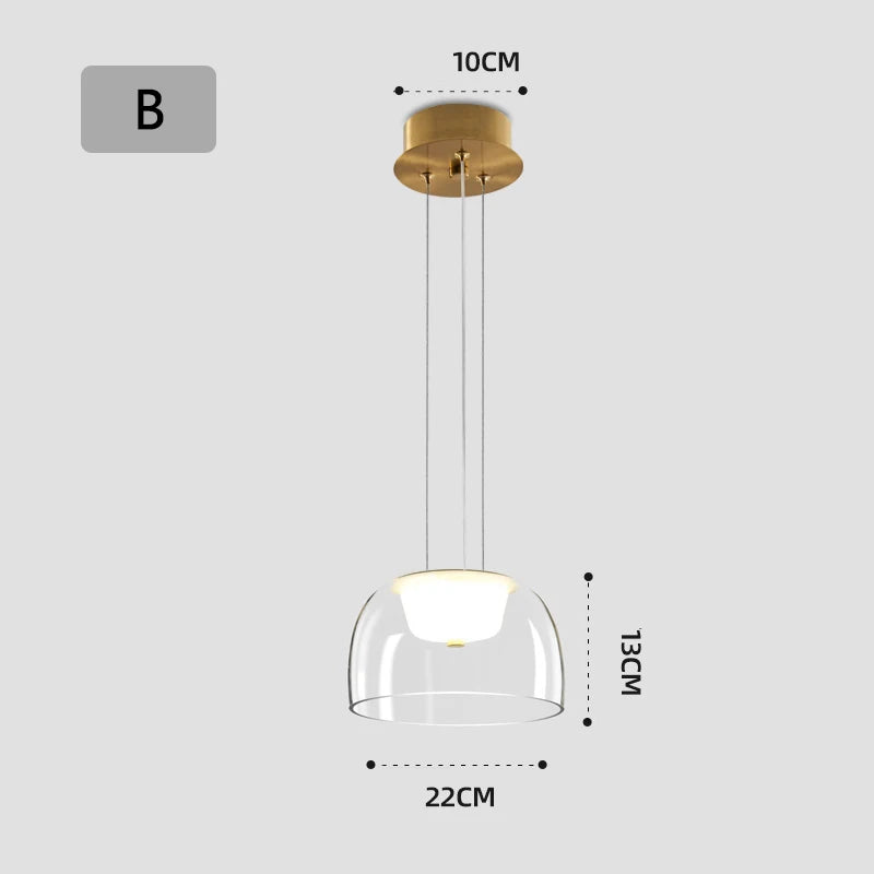 Gold pendant light with clear glass shade and dimensions on a white background