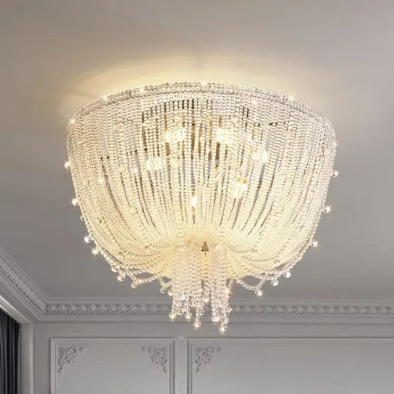 Close-up view of the polished chrome crystal waterfall pendant light showing the detailed crystal arrangement and light diffusion.
