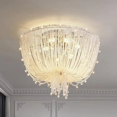 Close-up view of the polished chrome crystal waterfall pendant light showing the detailed crystal arrangement and light diffusion.