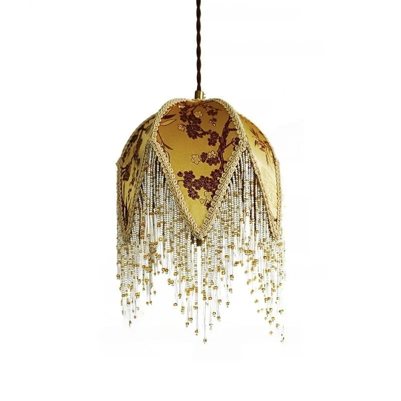 Decorative lamp with floral pattern and gold fringe 