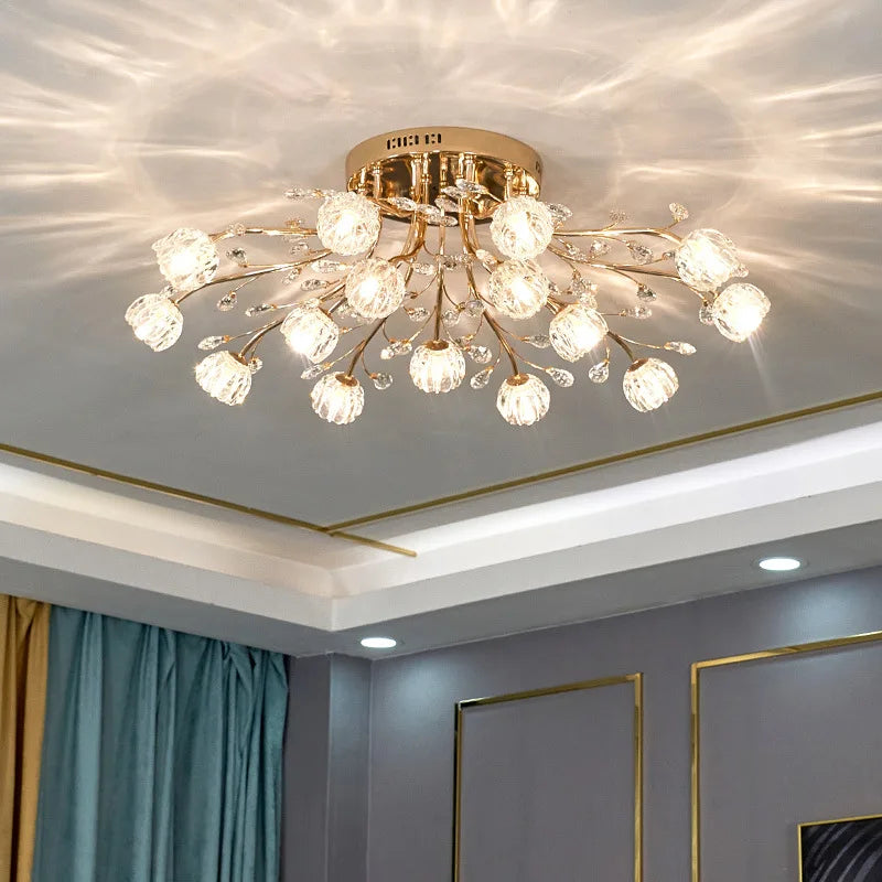 Close-up of the gold floral crystal chandelier, highlighting the crystal details and branches