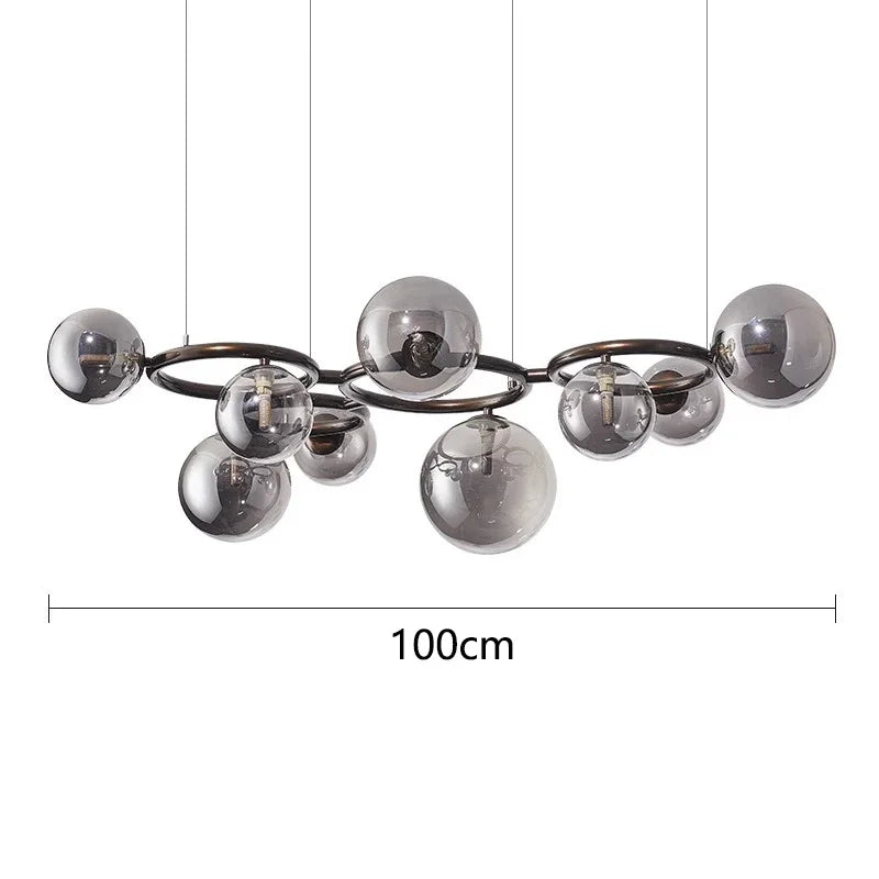 Chandelier with spherical glass shades and measurement label on a white background