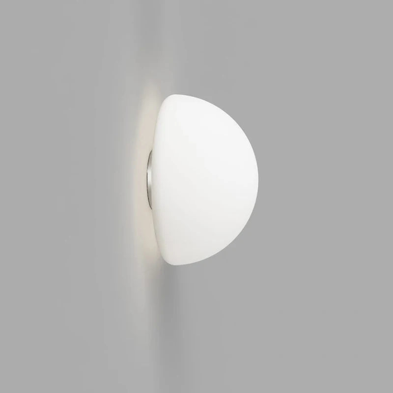 White semi-circular light fixture on a gray background
