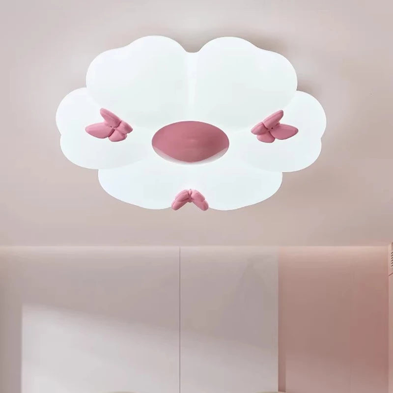 A white flower cloud semi-flush mount ceiling light with pink butterflies, viewed from below.